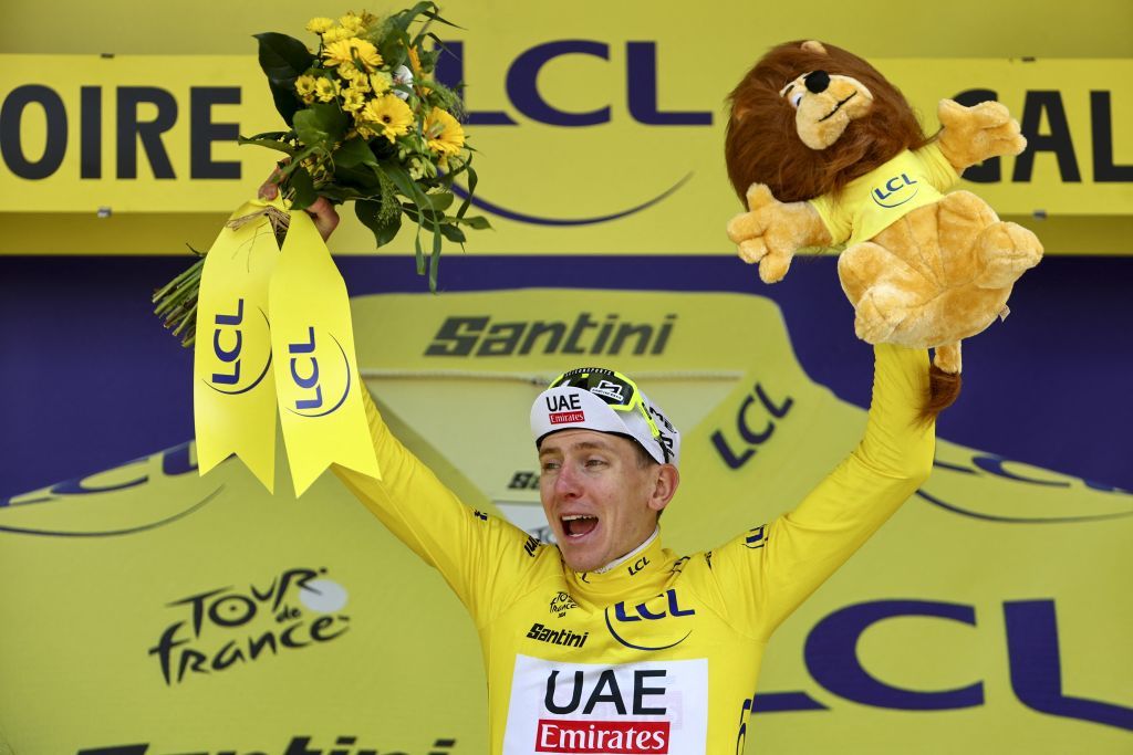 Slovenian Tadej Pogacar of UAE Team Emirates celebrates on the podium after winning stage 4 of the 2024 Tour de France cycling race, from Pinerolo, Italy to Valloire, France (139,6 km) on Tuesday 02 July 2024. The 111th edition of the Tour de France starts on Saturday 29 June and will finish in Nice, France on 21 July. BELGA PHOTO DAVID PINTENS (Photo by DAVID PINTENS / BELGA MAG / Belga via AFP)