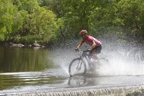 Cory Wallace flies through a river crossing