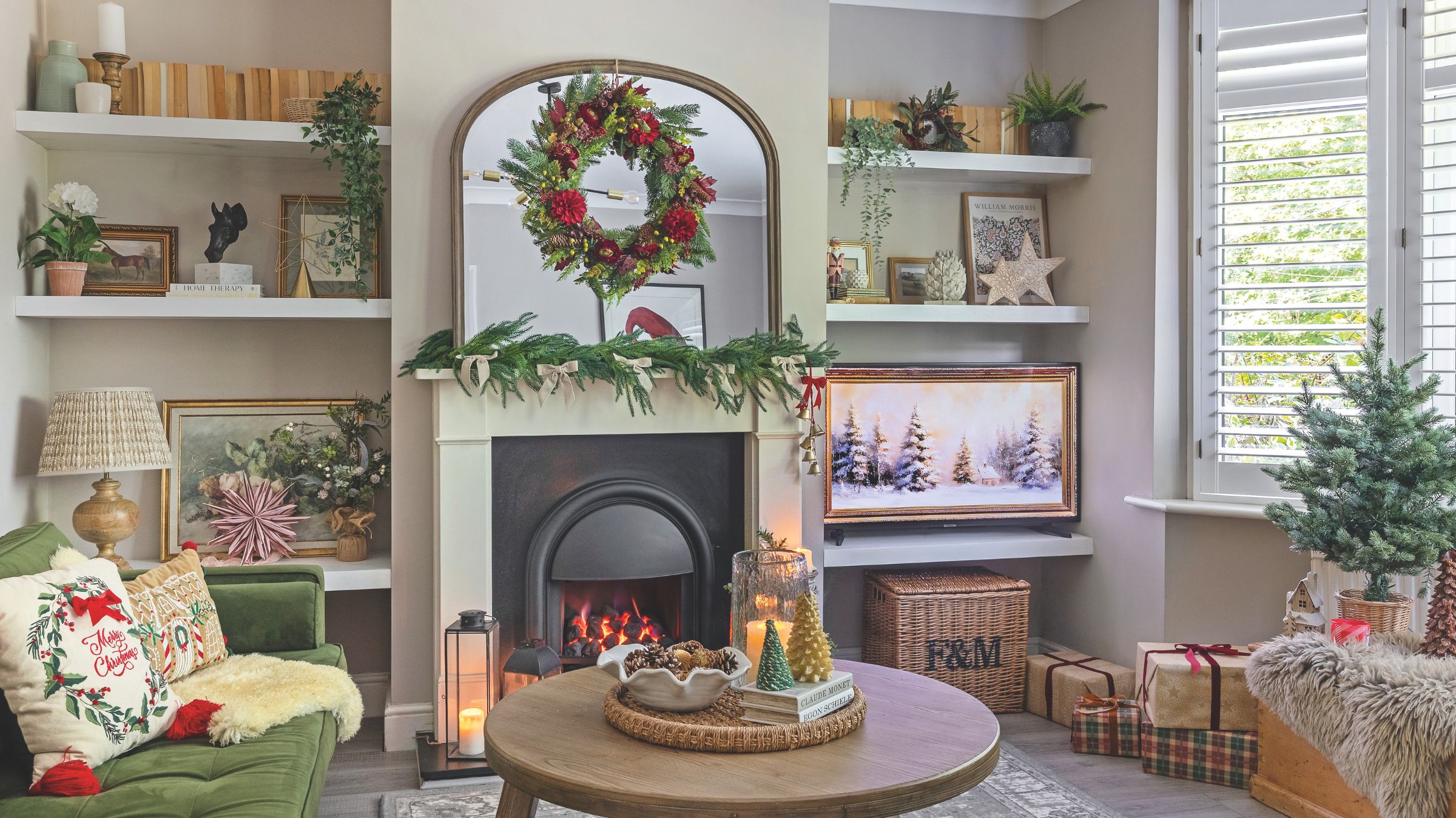 Living room with shelves either side of a fireplace, full of Christmas decorations