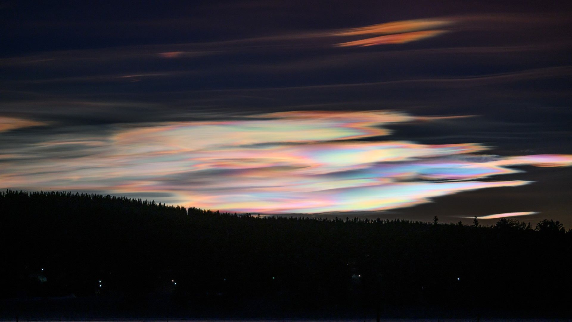 Spectacular 'rainbow clouds' light up northern skies in a rare
