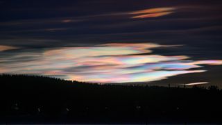 nacreous clouds above ice hotel sweden.