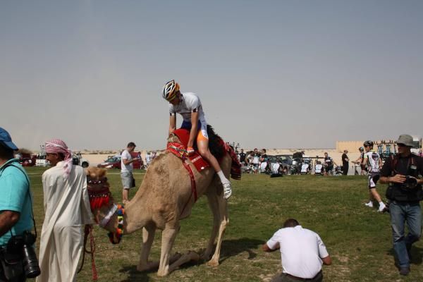 Lars Boom (Rabobank) gets in a camel ride before the start.
