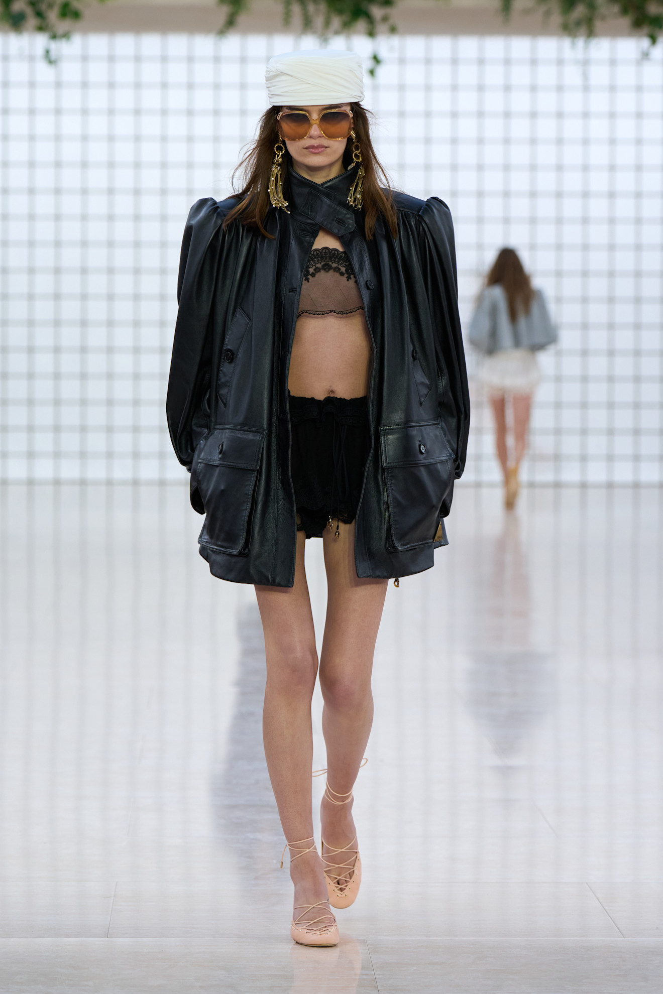 A Chloé model walks the spring/summer 2025 catwalk