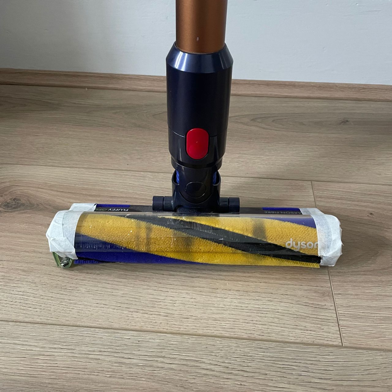 Dyson Gen5detect with masking tape on the edges of the floorhead