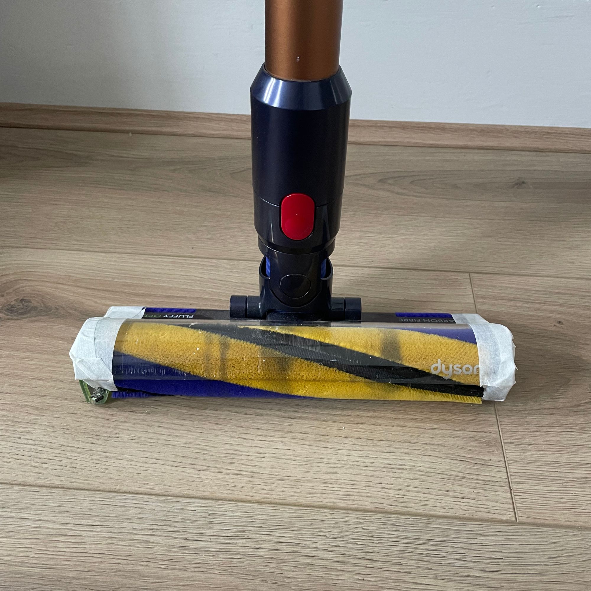 Dyson Gen5detect with masking tape on the edges of the floorhead