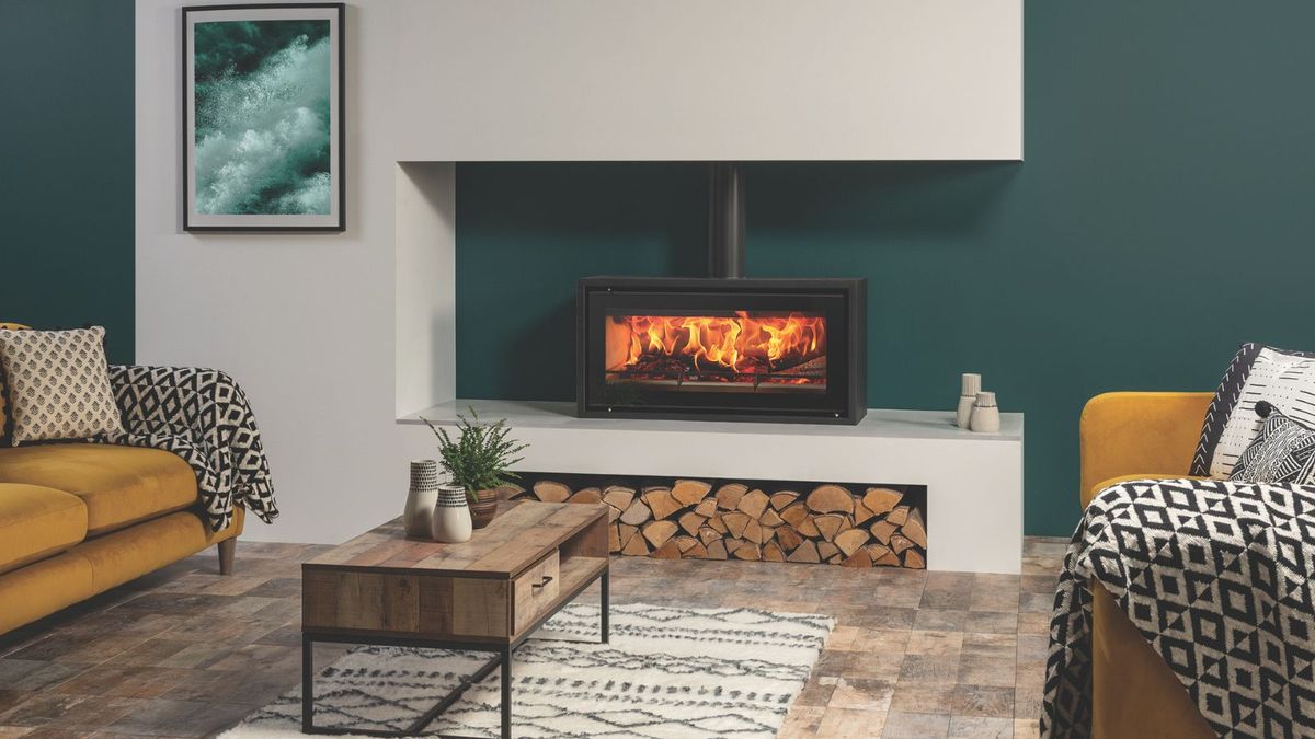 A contemporary inset log burner in a lounge