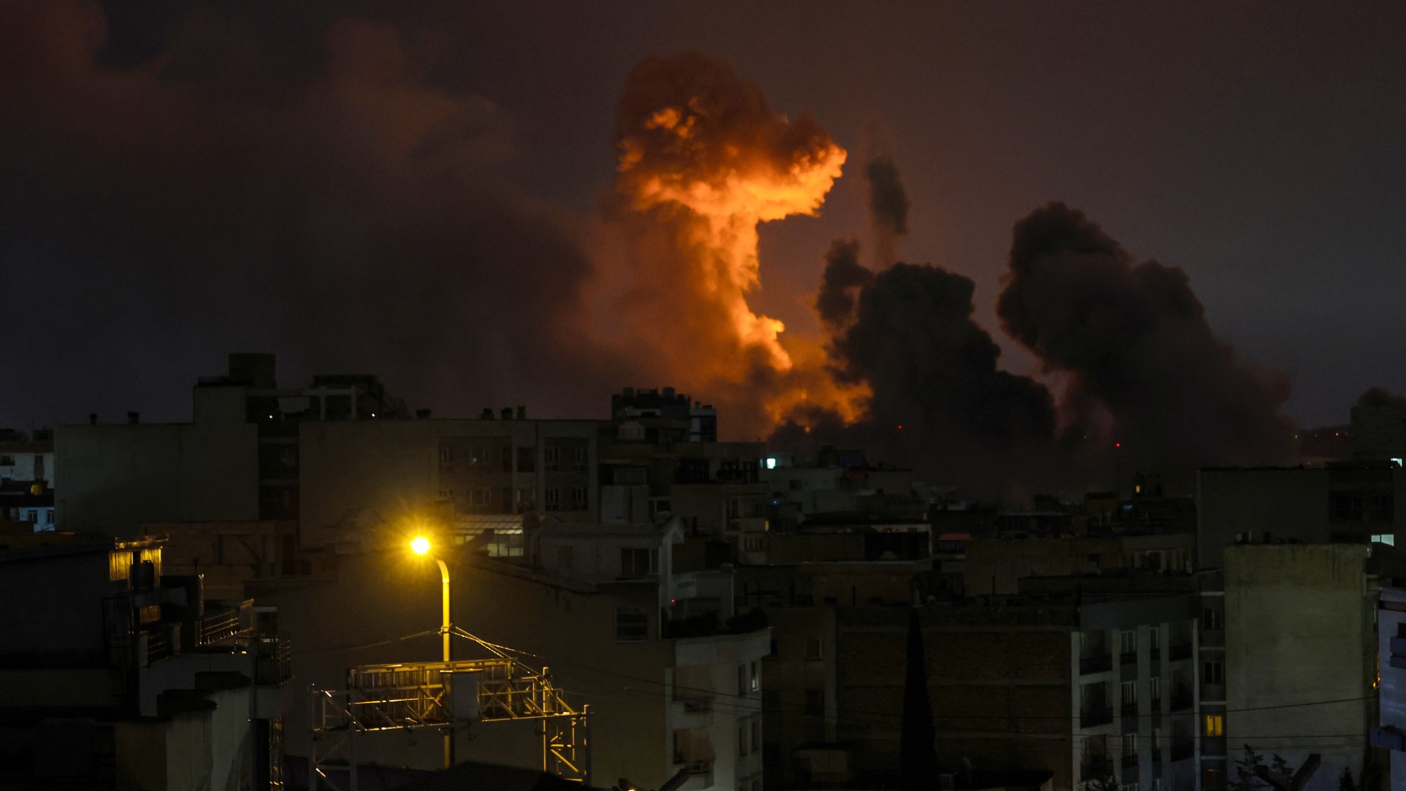 TEHRAN, IRAN - MARCH 28: A large plume of smoke rises over Tehran after explosions were reported in the city during the night on March 28, 2026 in Tehran, Iran. The United States and Israel continued their joint attack on Iran that began on February 28. Iran retaliated by firing waves of missiles and drones at Israel, and targeting U.S. allies in the region. (Photo by Getty Images)