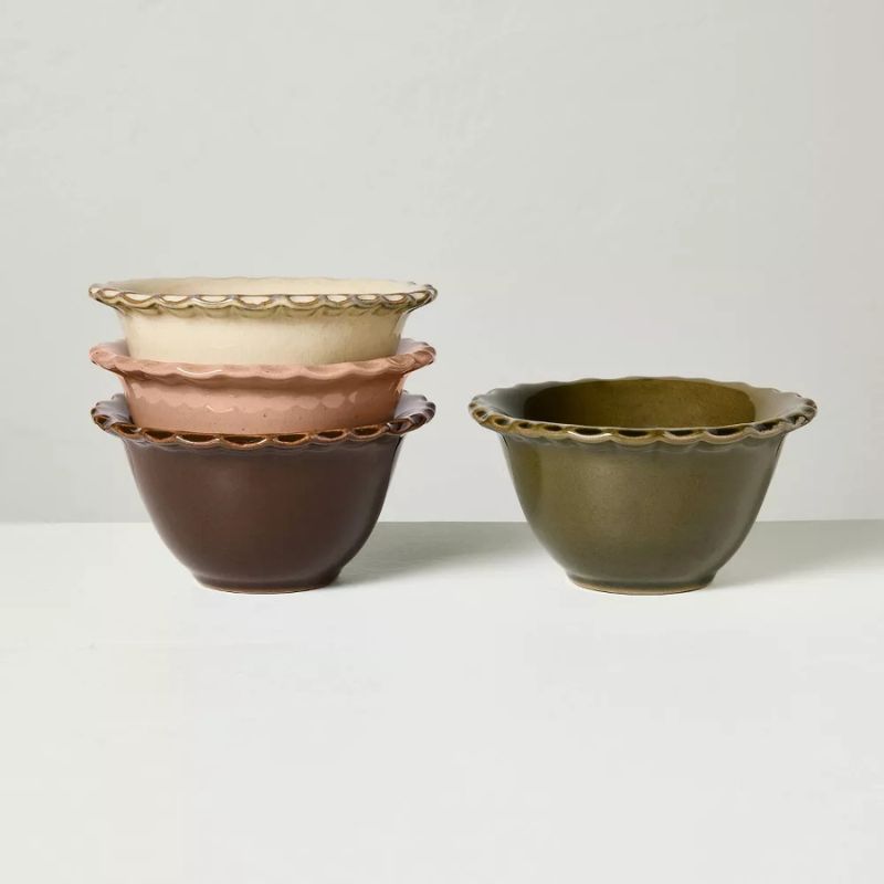 Set of 4 mini stone bowls in brown, cream, khaki and pale pink, all with scalloped edges