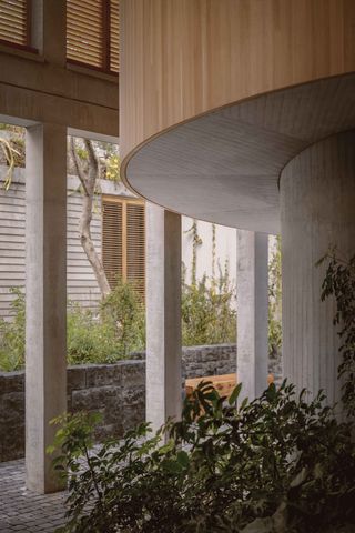 columns and round forms at Parque Vía house, a Mexican house by SOA