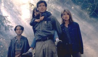 Dante's Peak Pierce Brosnan and Linda Hamilton make their way through the forest with kids