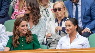 Catherine, Duchess of Cambridge and Meghan, Duchess of Sussex in the Royal Box on Centre Court at Wimbledon