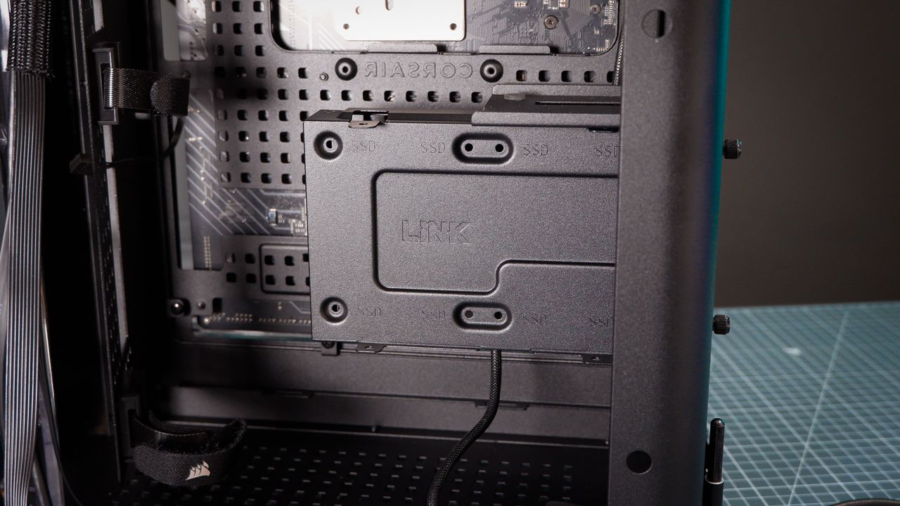 A Corsair Air 5400 PC case on a desk with various parts installed.