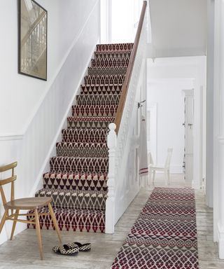 Fairisle printed stair case runner and carpet runner by Margo Selby with chair and pair of shoes in shot