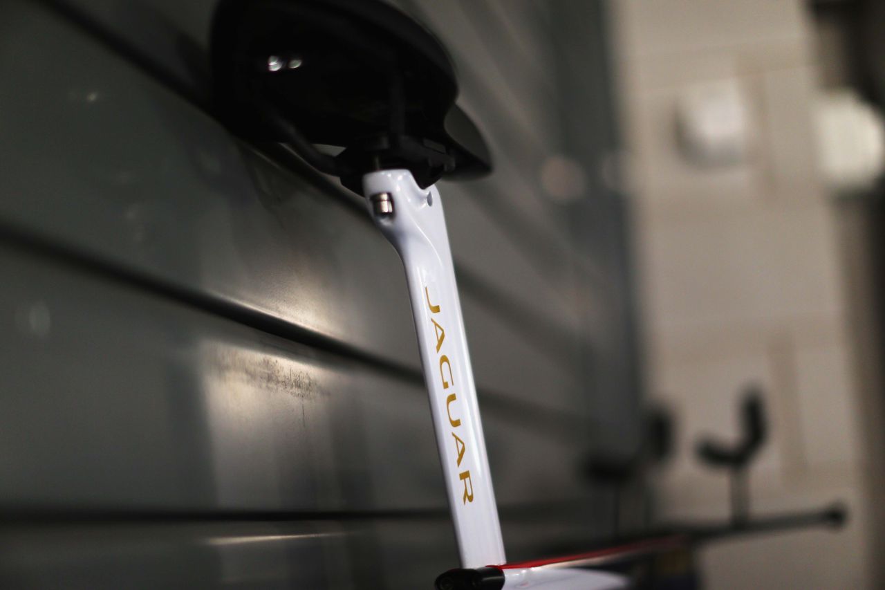 The Pinarello Bolide HR has a white seat stem with a Jaguar logo