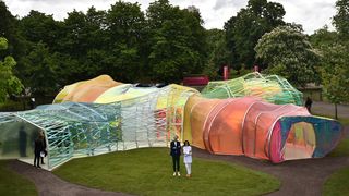 Spanish architects Lucia Cano (R) and Jose Selgas pose by their Serpentine pavilion structure at the Serpentine Gallery in London on June 22, 2015. For the last 15 years the Serpentine galler