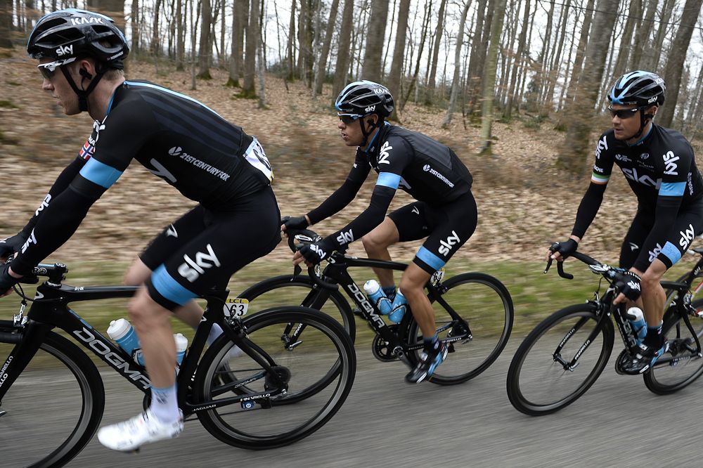 Cyclists of the Great Britain's Sky cycling team, (From L) Norway's Lars-Petter Nordhaug, Australia's Richie Porte and Ireland's Nicolas Roche ride in the pack.