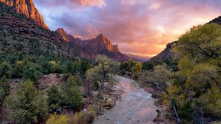 The Virgin River winds through Zion Canyon in Utah at sunset