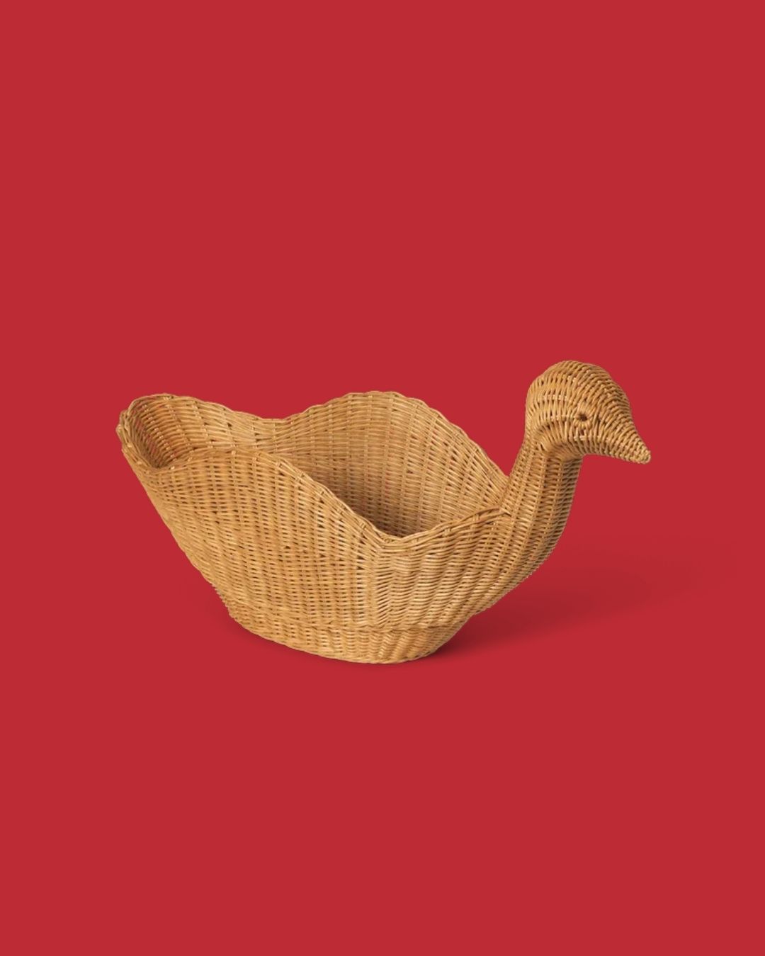 A series of sculptural rattan decorative items, including place mats, cake stands, laundry baskets, lights, napkin rings, and storage units.