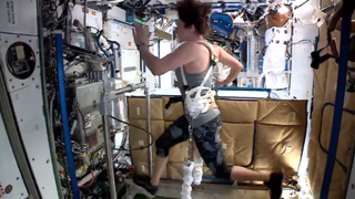 Jessica Meir runs on the T2 treadmill in space.