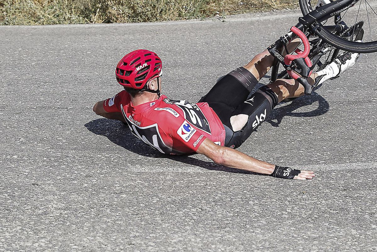 Chris Froome (Team Sky) tires to stop the slide during his crash