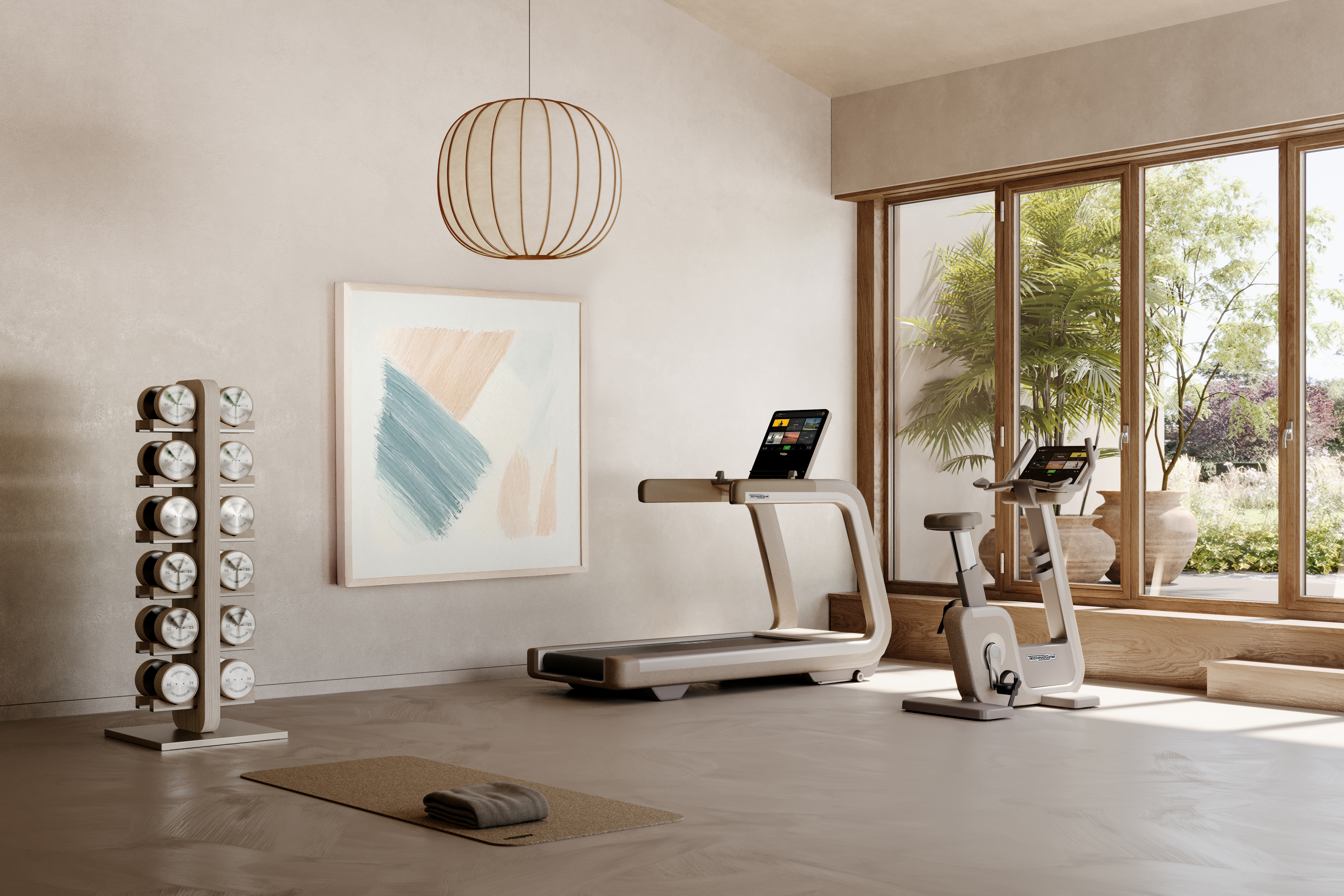 An image of a suite of Technogym equipment released in a 'sand' color, showcased in a beige room complete with a treadmill, stationary bike, weights, and a yoga mat.