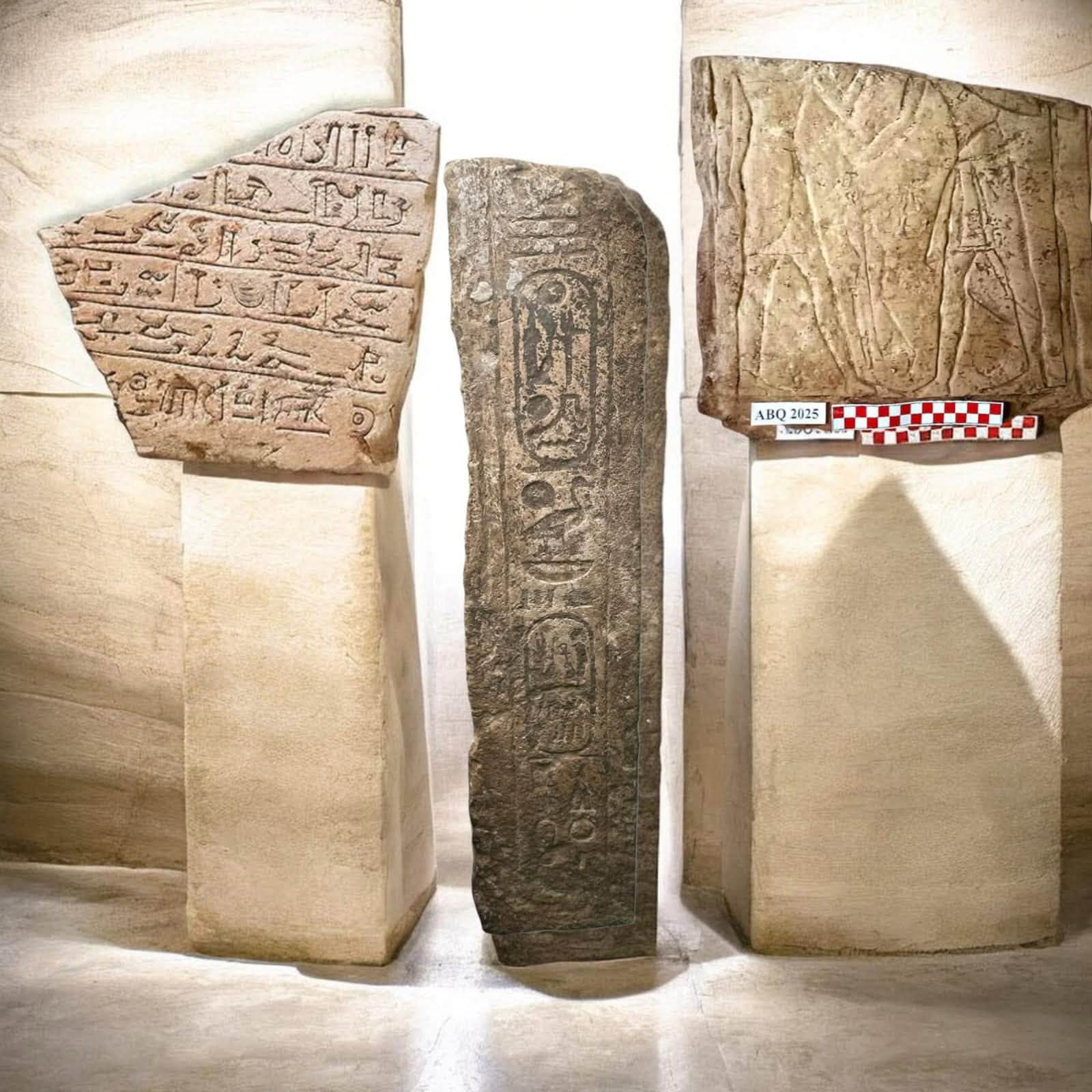 A view of three stone slabs with carvings on them.