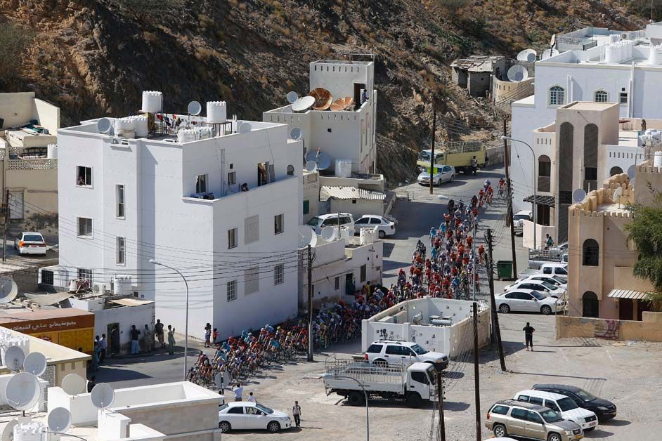 The peloton cuts through a town