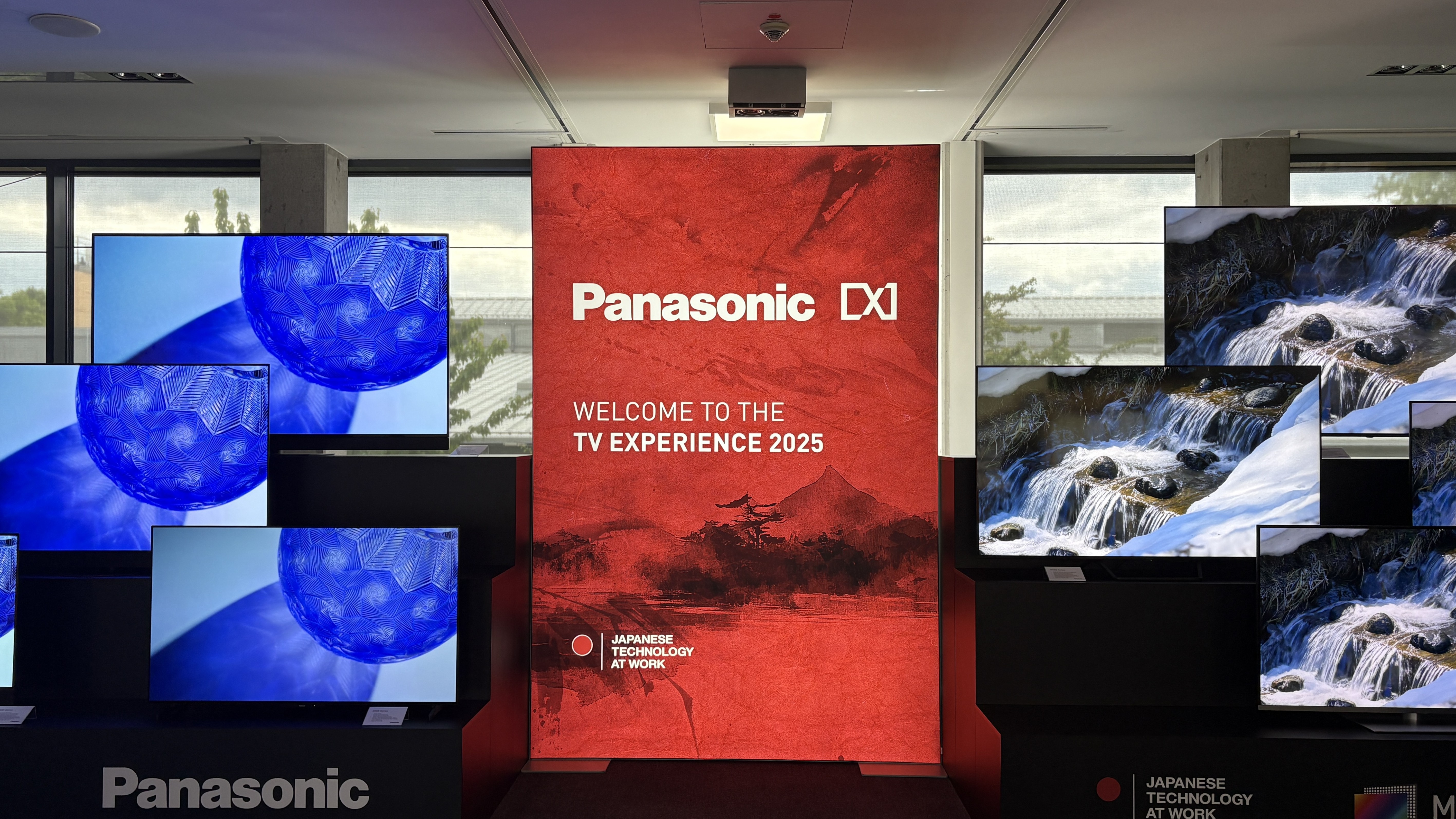 Panasonic TVs on a black show stand