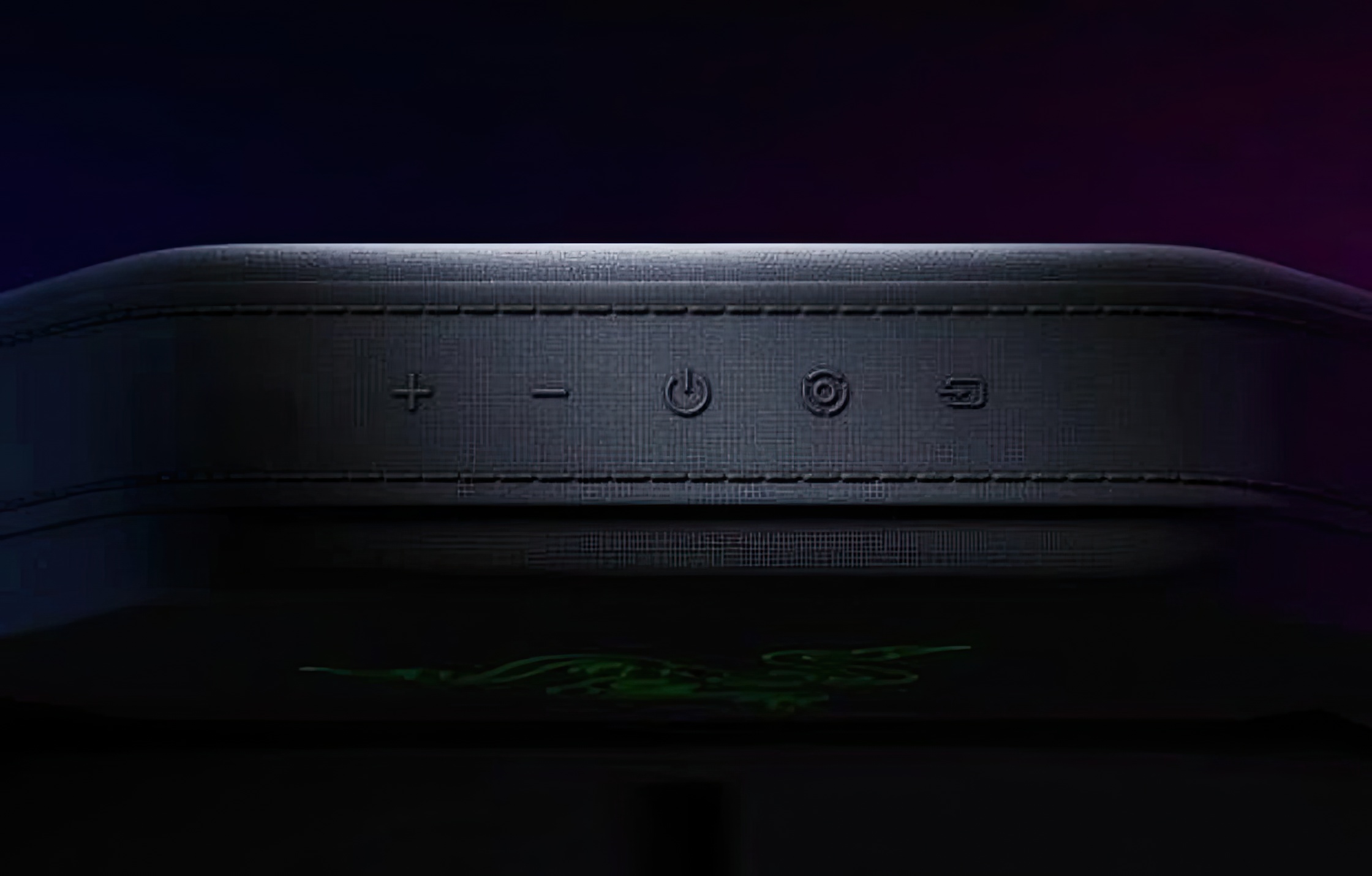 Press images of the Razer Chroma gaming chair, in black, with RGB lighting on the headrest