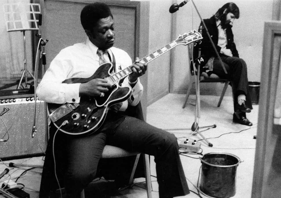 B.B. King poses for a portrait with his Gibson electric hollowbody guitar nicknamed 'Lucille' in the studio with drummer Ringo Starr during the recording of his album 'B.B. King In London' which was recorded on June 9-16 in London, England.