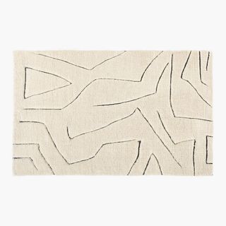 cream rug with line pattern design