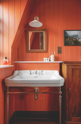 Orange panelled bathroom