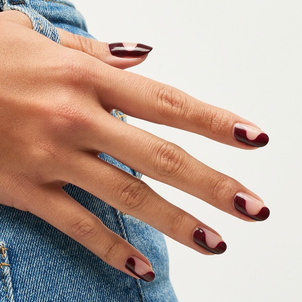 Burgundy wavy nail design