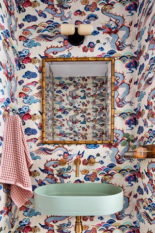 powder room with blue and red patterned wallpaper