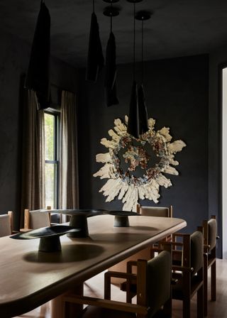 Black dining room with gold accents