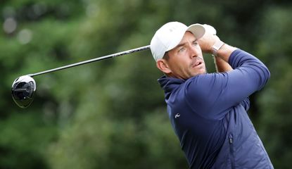 Stallings hits a tee shot with driver