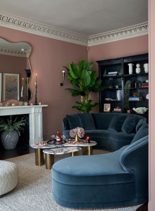 Pink living room with blue sofa