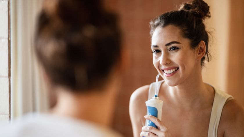 Woman using a water flosser
