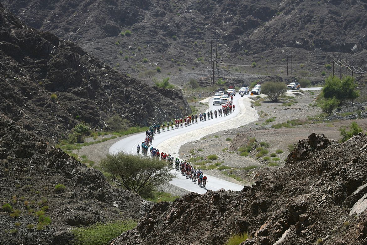 The peloton is lined out in pursuit of the break