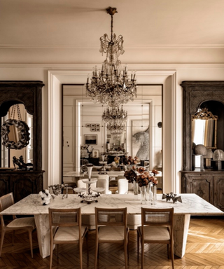 Grand dining room with parquet floors and chandelier