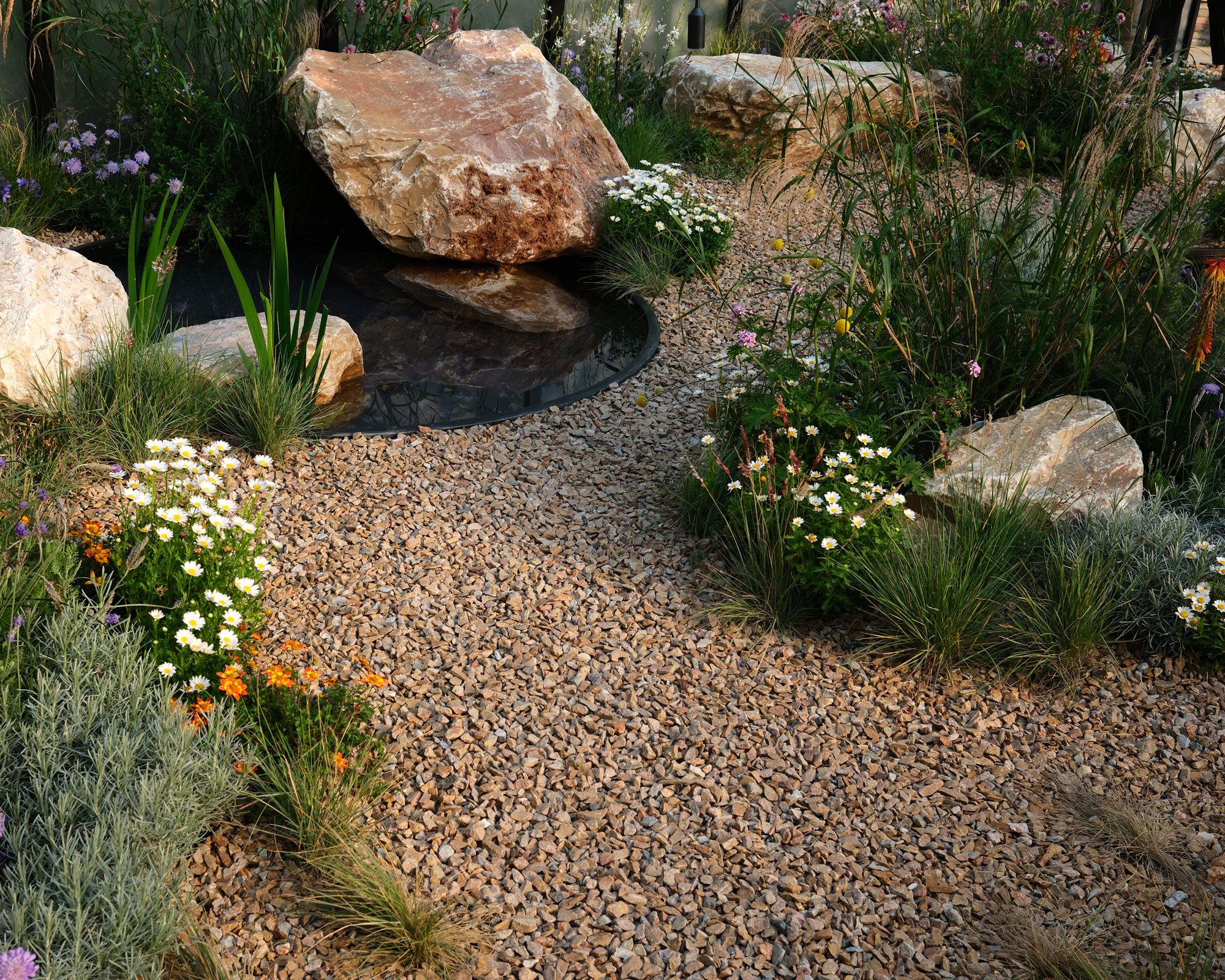 dry river garden design with gravel, landscaping rocks and drought tolerant plants