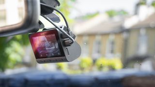 70mai A810 dashcam attached to a car windscreen