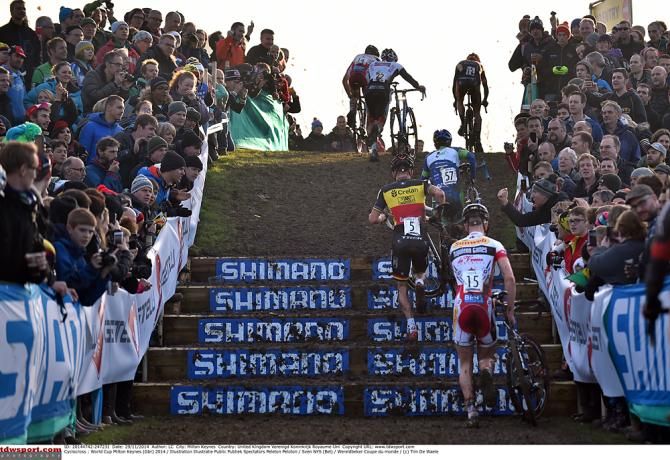 The riders dismount and run up the stairs on course