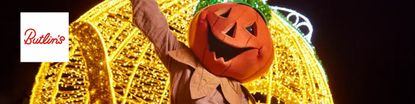 Woman wearing pumpkin head