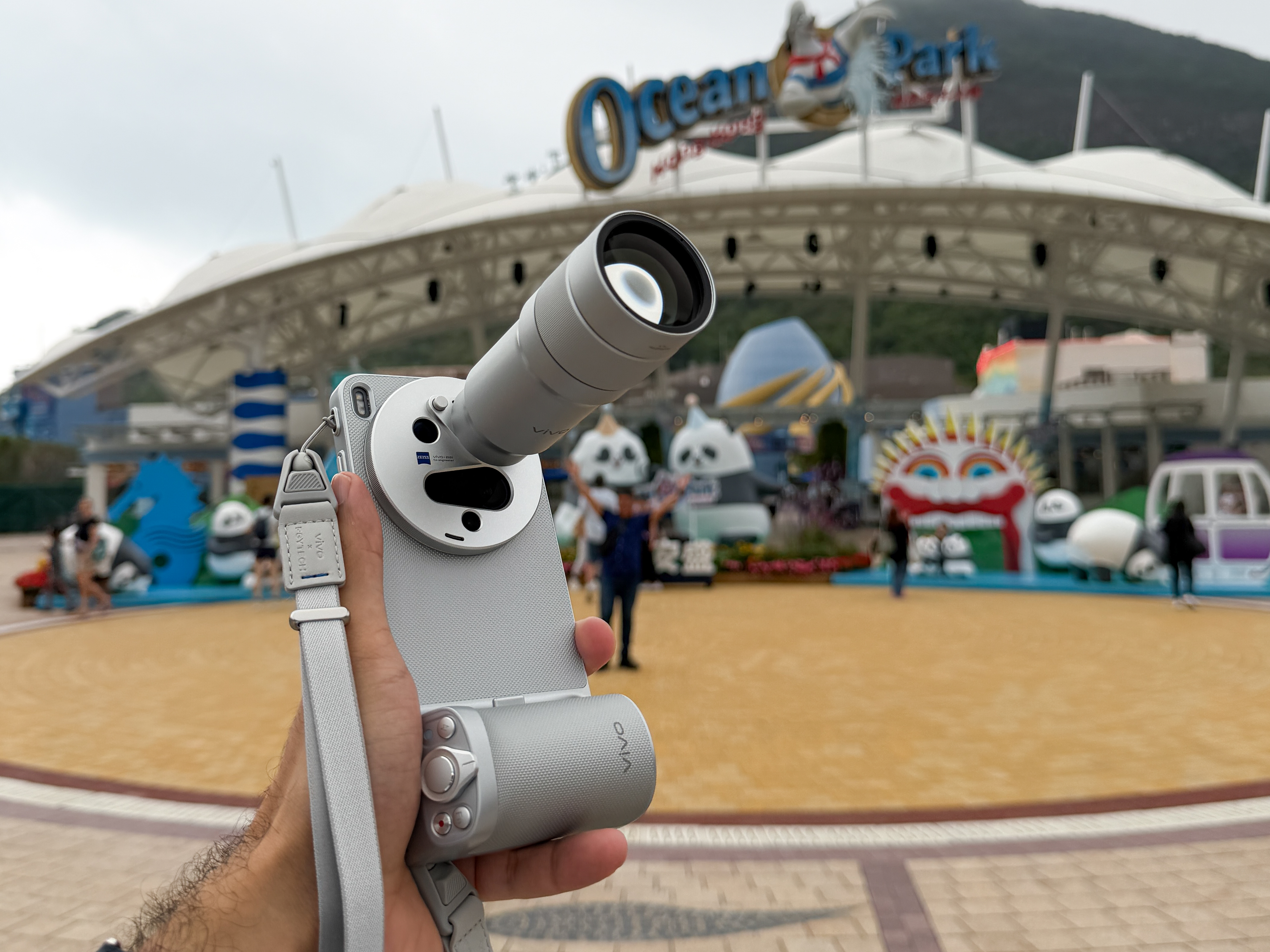 Prakhar Khanna using the Vivo X300 Ultra with the camera kit attached to it.