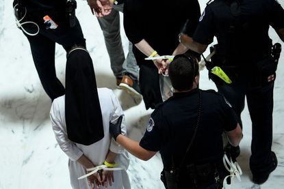 Capitol Police arrest a nun protesting Trump&amp;#039;s immigration policies.