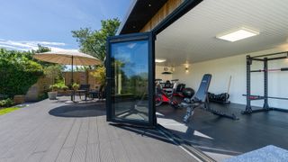 Composite decking used to zone a home gym and relaxation area