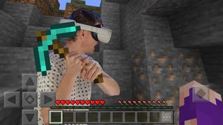 A mockup of me wearing a Quest 2 headset playing Minecraft VR while using a diamond pickaxe