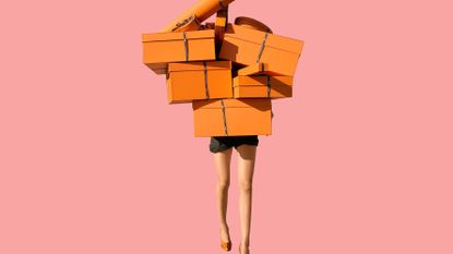 a person carrying many orange gift boxes