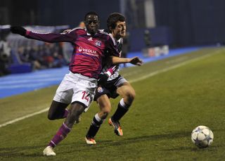 Lyon's Mouhamadou Dabo (left) vies with Dinamo Zagreb's Mateo Kovacic during a Champions League match in December 2011.